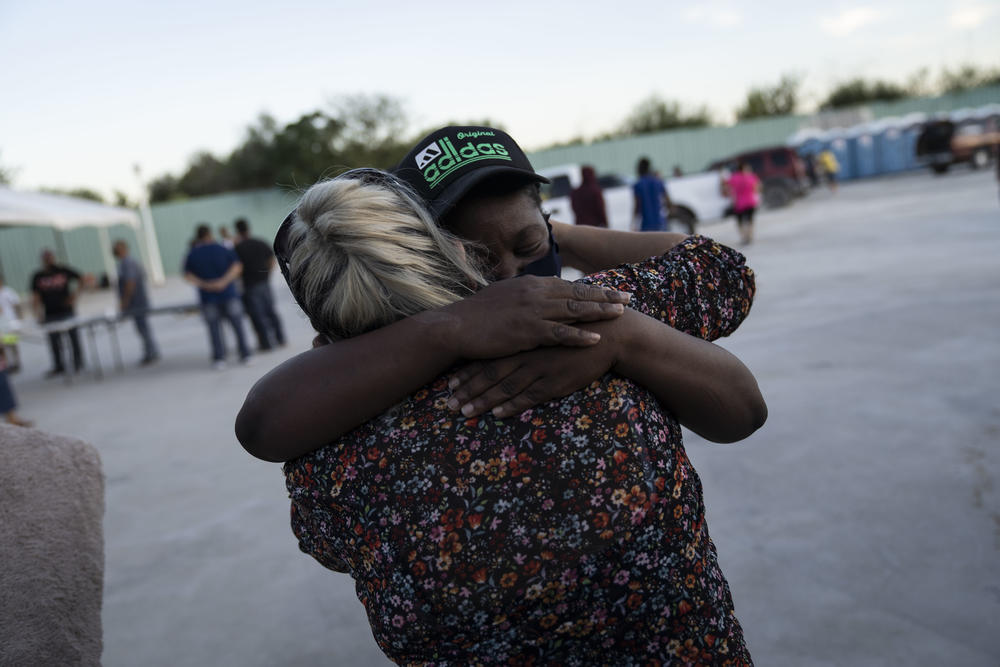 A migrant embraces a woman at a shelter in Ciudad Acuña, Mexico.