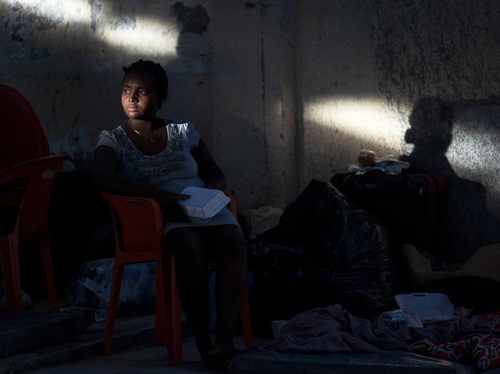 A Haitian migrant sits in a shelter in Ciudad AcuÃ±a, Mexico.