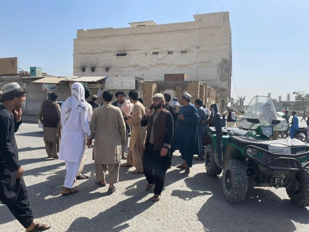 People gather at the scene after a bomb blast hits a Shiite mosque in Afghanistan's southern Kandahar province on Friday.