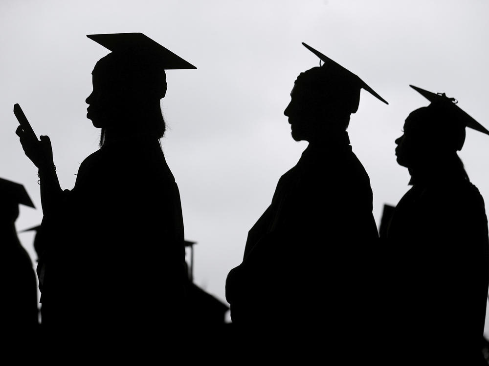 New graduates line up before the start of a community college commencement in East Rutherford, N.J., on May 17, 2018.