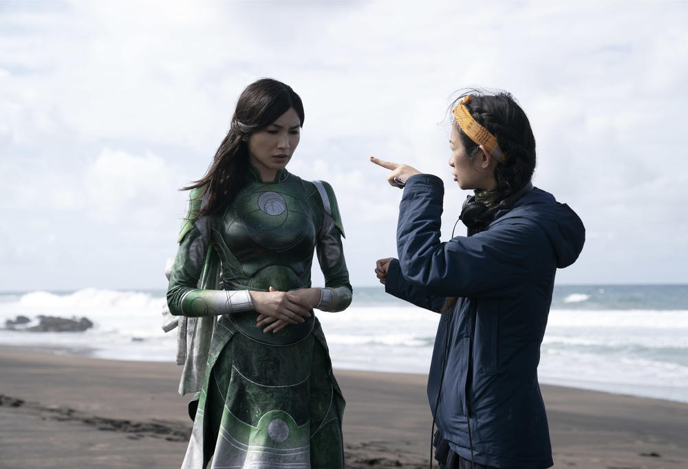 Gemma Chan and director Chloé Zhao on the set of <em>Eternals</em>.