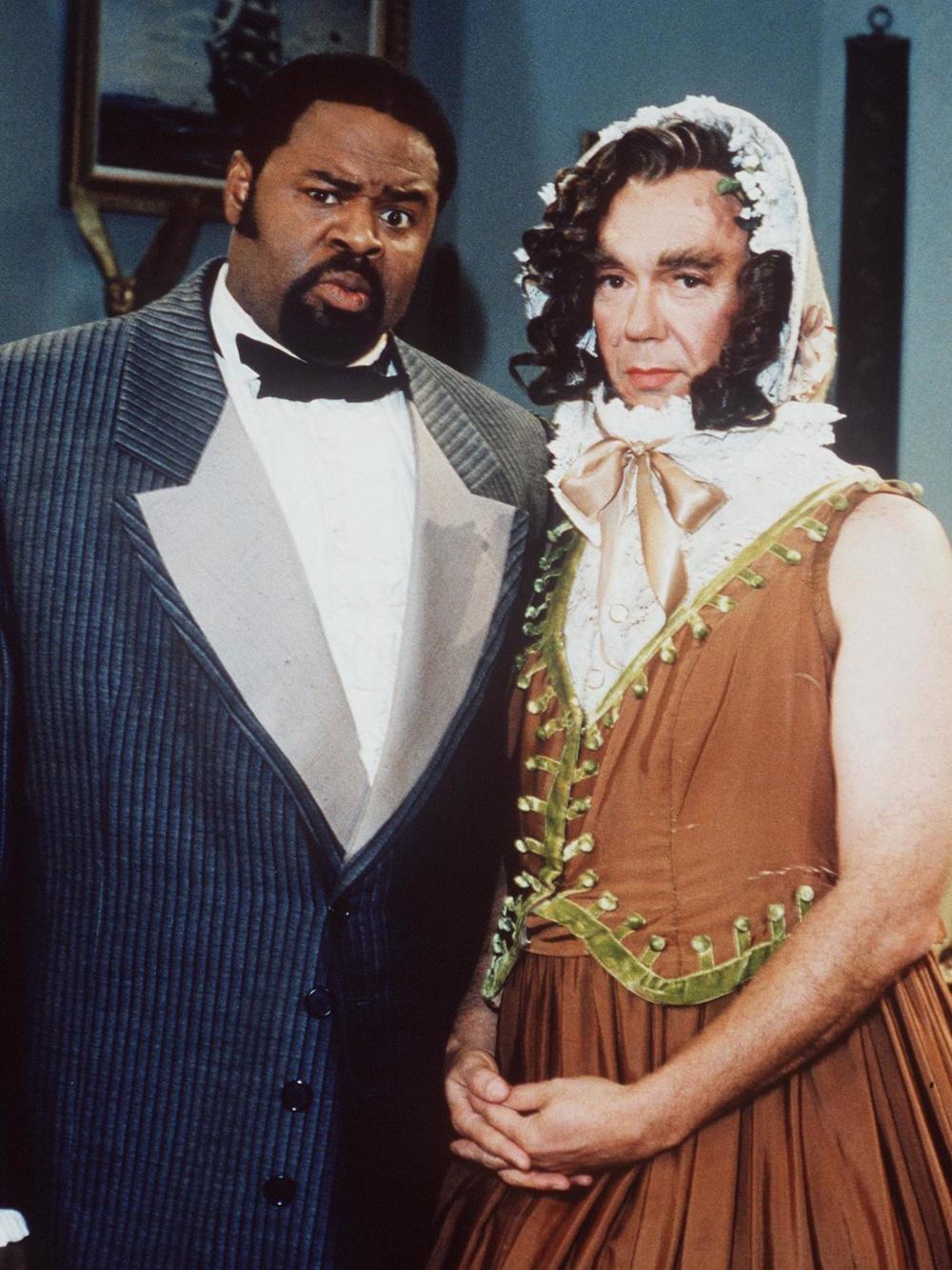 Chi McBride as butler Desmond Pfeiffer and Dann Florek as a disguised Abraham Lincoln in the UPN show The Secret Diary of Desmond Pfeiffer.