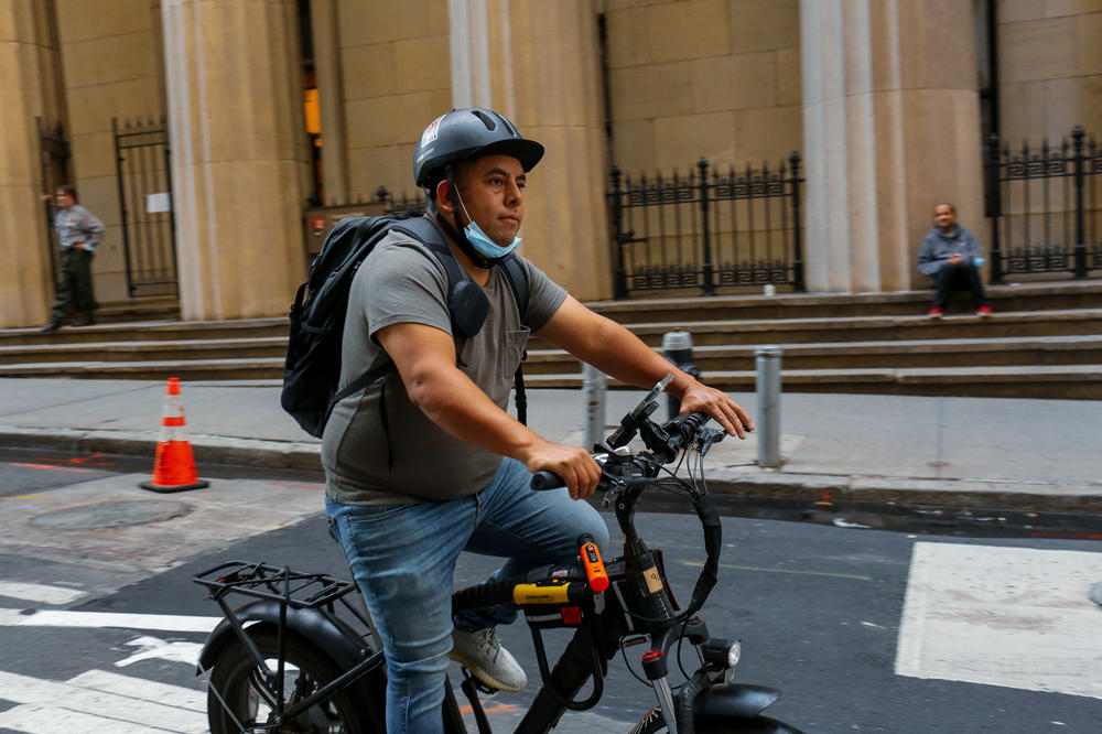 Gustavo Ajche was laid off from his pizza delivery job during the pandemic and switched to delivering food for apps like DoorDash and GrubHub.