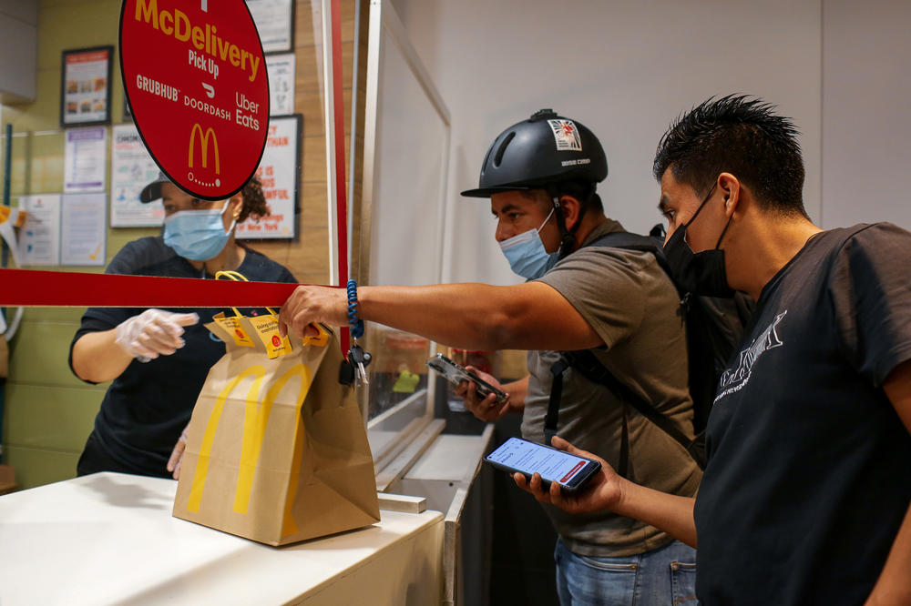 Gustavo Ajche picks up an order from McDonald's.