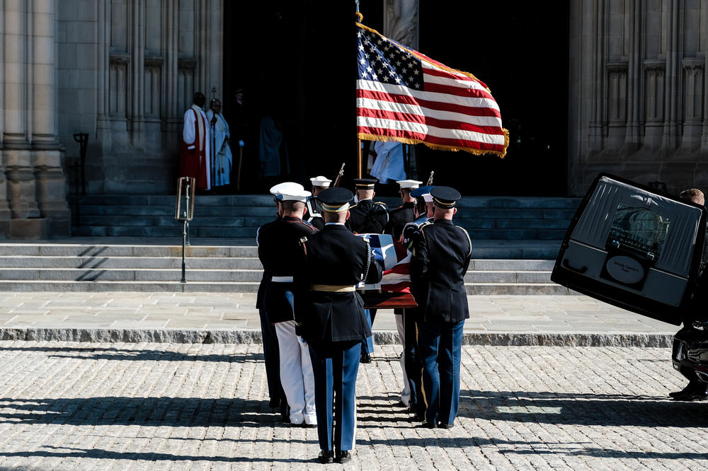 Members of the Honor Guard carry Colin Powell's casket. Powell was national security adviser to President Ronald Reagan and served two tours in Vietnam.