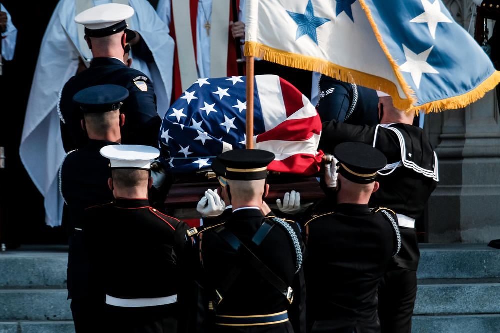 Members of the Honor Guard carry the casket. Powell served as secretary of state during the presidency of George W. Bush and led the first Gulf War as chairman of the Joint Chiefs of Staff.