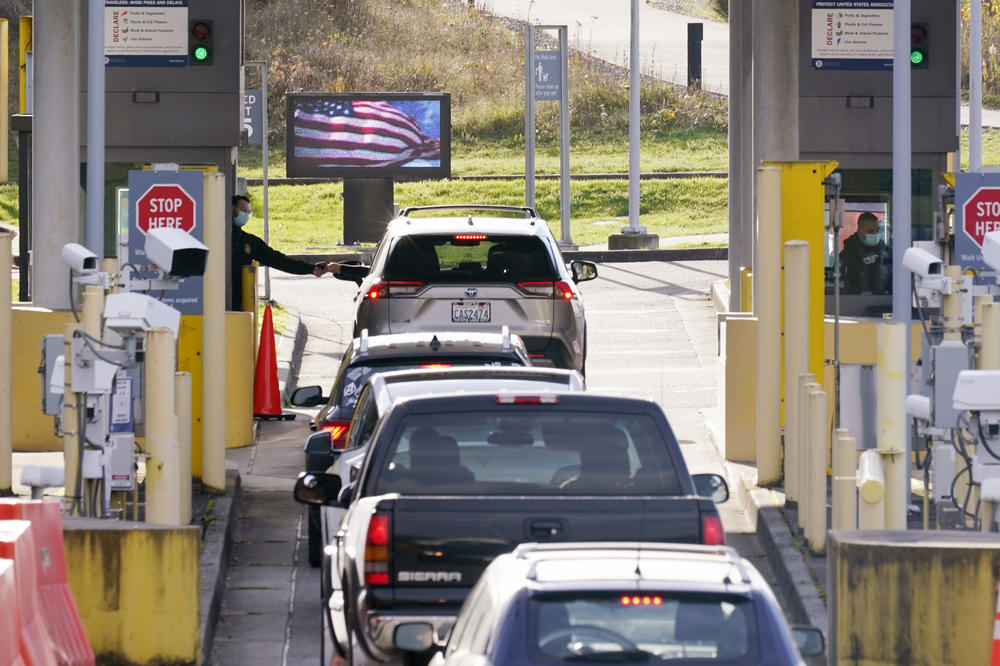 Cars line up to enter the U.S. from Canada at the Peace Arch border crossing in Blaine, Wash.