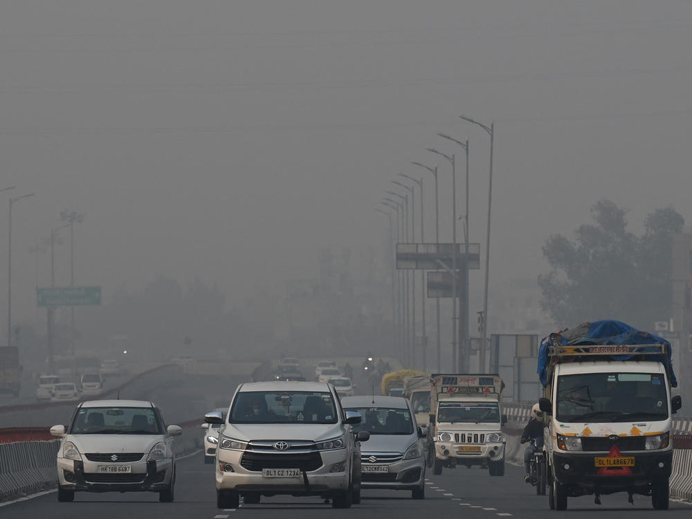 Commuters drive along a road amid heavy smog conditions in New Delhi last week.