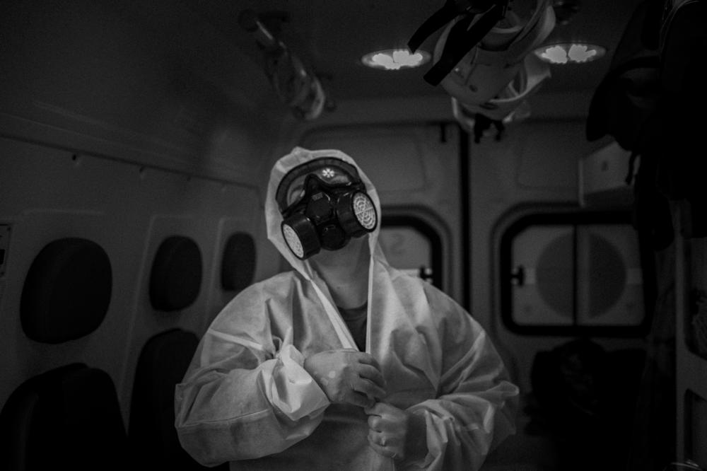 Dr. Alessandra Said, 45, puts on protective clothing at the Mobile Emergency Care Service in southern Manaus, before starting the last 12 hours of a shift that would last 36 hours in total, on May 2, 2020.