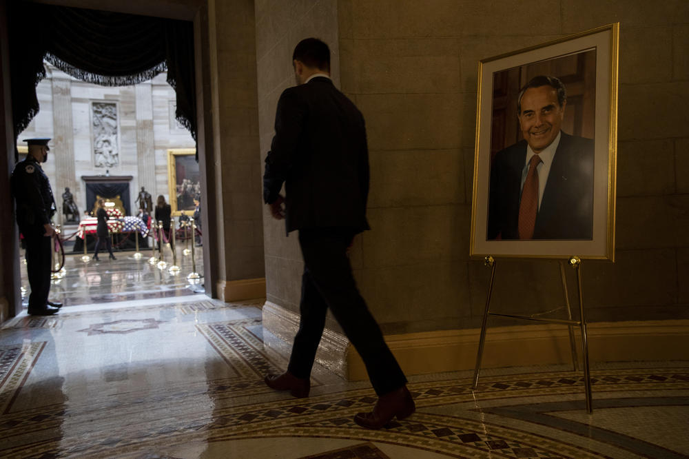 In the rotunda of the U.S. Capitol, the casket of former Sen. Bob Dole lies in state as people walk through to pay their respects.