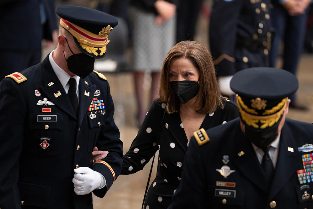 Robin Dole, center, is escorted into a ceremony for her late father, former Sen. Bob Dole at the Rotunda of the U.S. Capitol on Dec. 9, 2021 in Washington, D.C.
