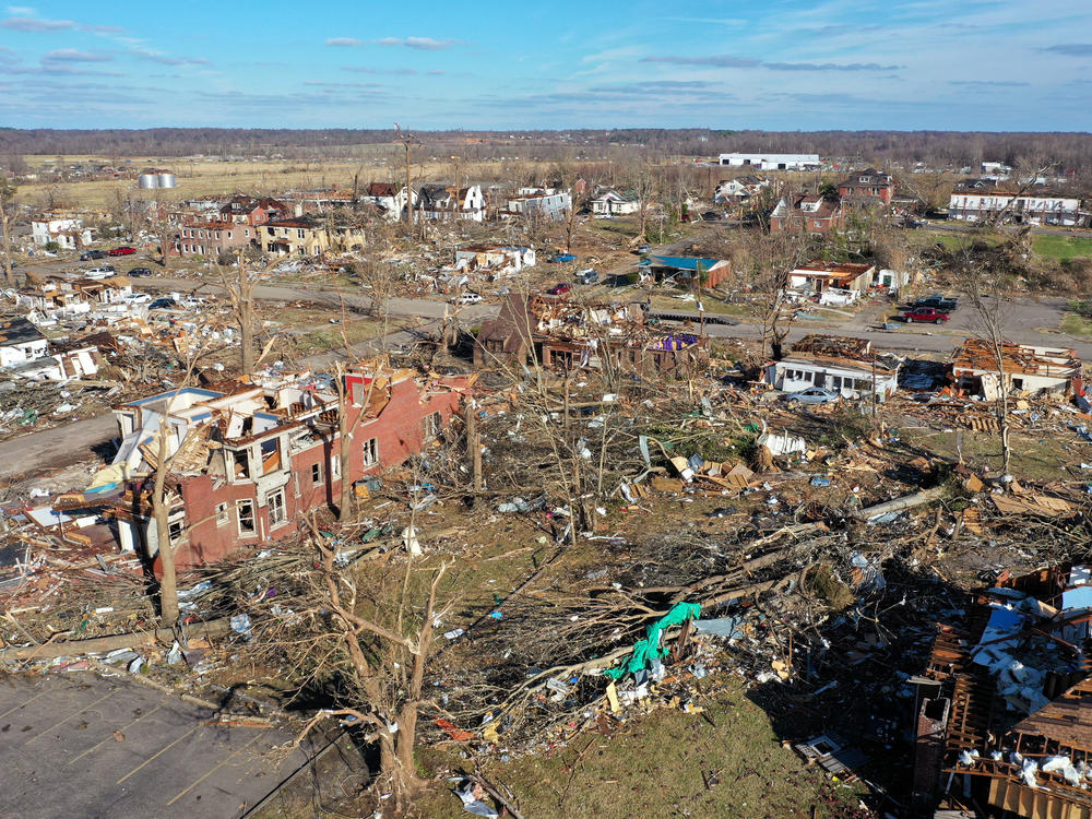 Destruction was evident throughout Mayfield, Ky., on Saturday, after a tornado ripped through the area. Scores of people were killed in Kentucky.