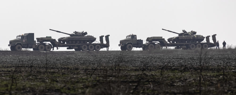 Ukrainian tanks are transported toward the Luhansk region in eastern Ukraine on Sunday. Ukraine says its military is much better prepared than in 2014, when Russia invaded and seized Crimea. However, Russian forces are still considered much stronger.