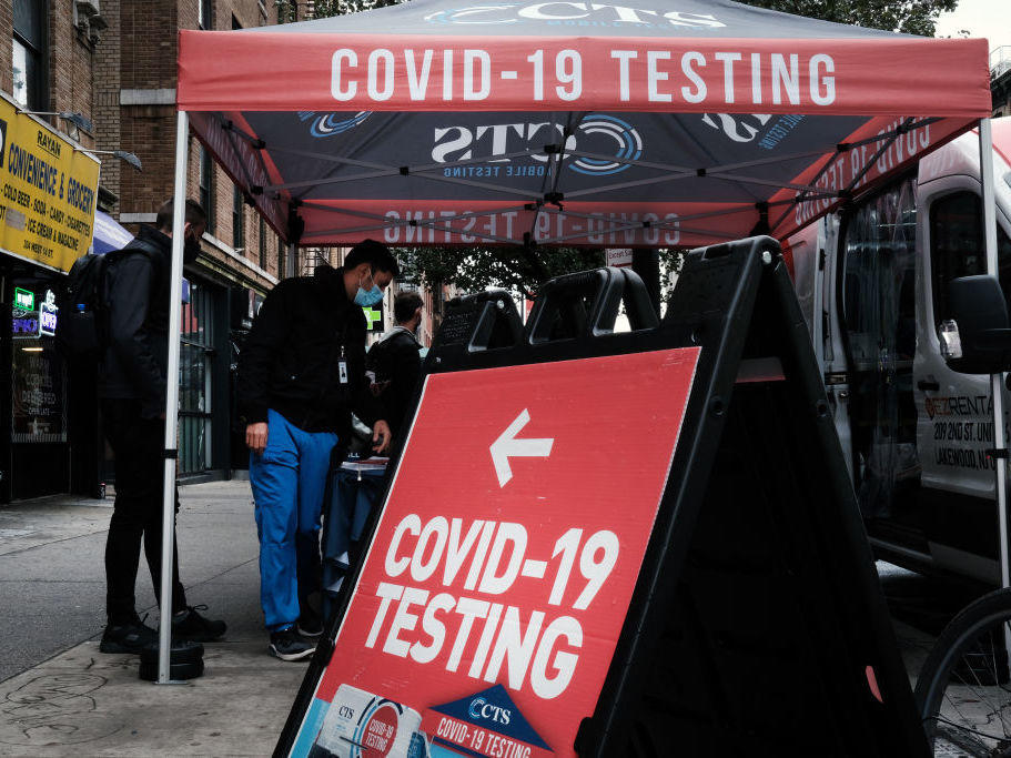 A COVID-19 pop-up testing site stands on a Manhattan street in October in New York City. On Tuesday, Pfizer released promising data about a pill to treat COVID-19.