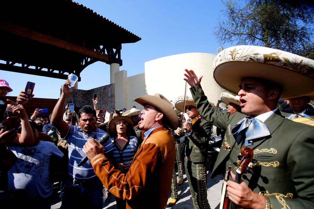 Musicians pay tribute to Mexican singer Vicente Fernández outside the Rancho los Tres Potrillos in Tlajomulco, Mexico, on Dec. 12, on the day of his death.