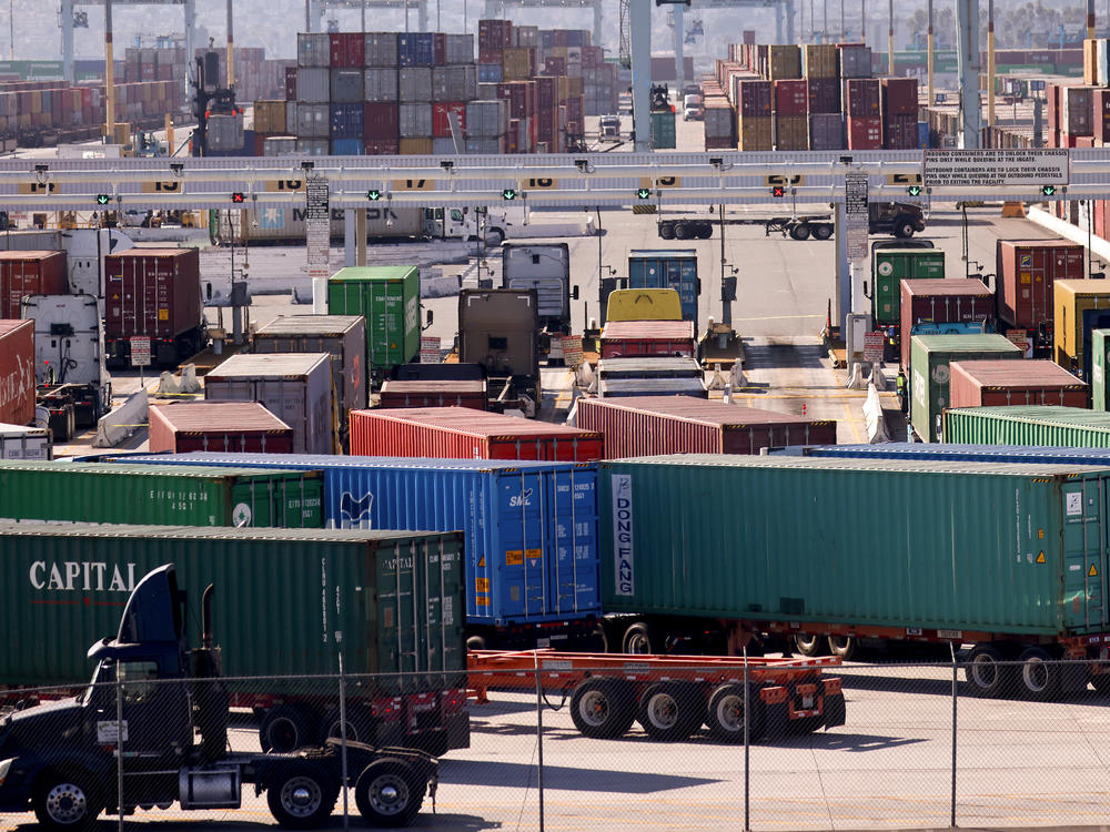 Trucks haul shipping containers at the Port of Los Angeles on Nov. 24, just ahead of the semiofficial start of the holiday season. For much of the country, trucking is the only freight option.