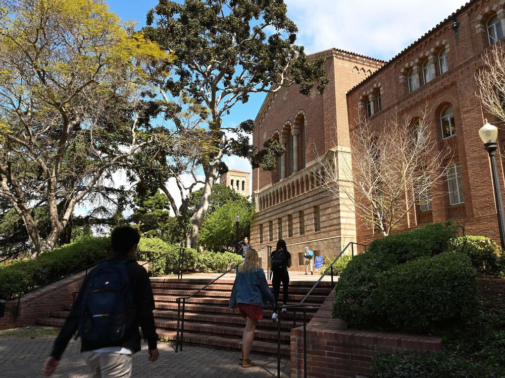 Students walk on the campus of University of California at Los Angeles (UCLA) in Los Angeles in March 2020.