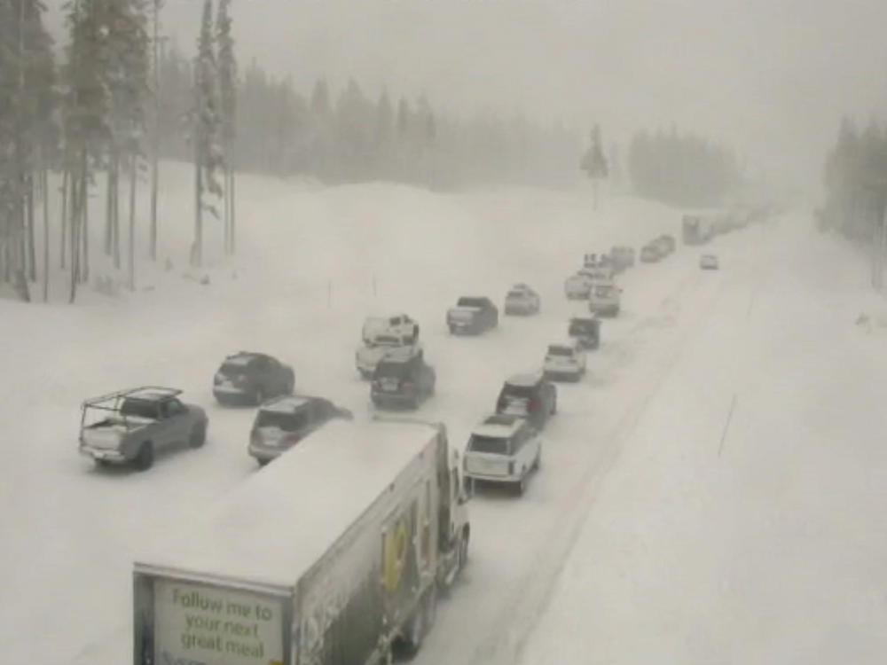 In this image taken from video from a Caltrans remote video traffic camera, vehicles are backed up on a snow-covered Interstate 80 at Donner Summit, Calif., on Thursday. Snow continued over the Christmas weekend in the area.