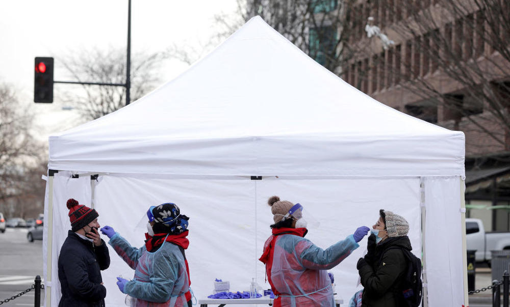 People get tested for COVID-19 at a free testing site in Washington, D.C., on Dec. 21 as coronavirus cases surge in the city.