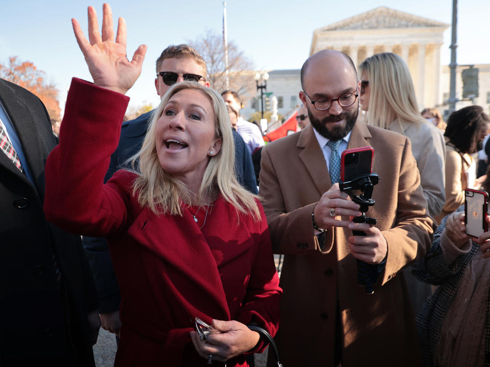 Rep. Marjorie Taylor Greene, R-Ga., joins fellow anti-abortion activists in front of the U.S. Supreme Court on Dec. 1, 2021, as the justices hear arguments on a case about a Mississippi law that bans most abortions after 15 weeks.