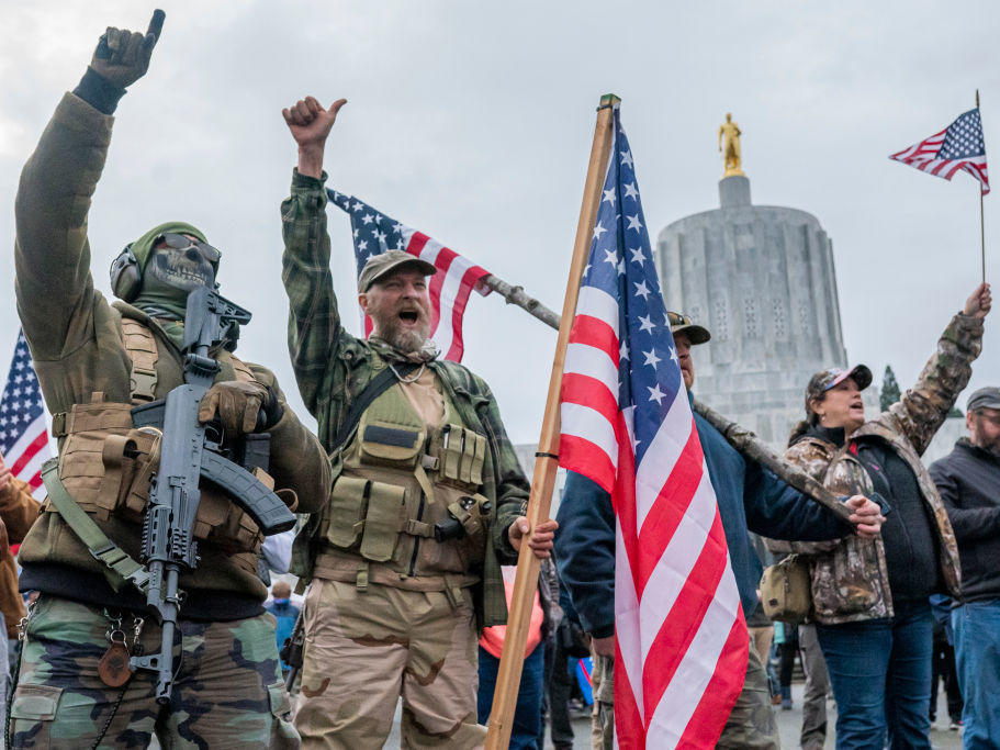 Armed supporters of President Donald Trump chant during a protest on Jan. 6, 2021, in Salem, Ore. Trump supporters gathered at state capitols across the U.S. that day to protest the ratification of Joe Biden's Electoral College victory over Trump.