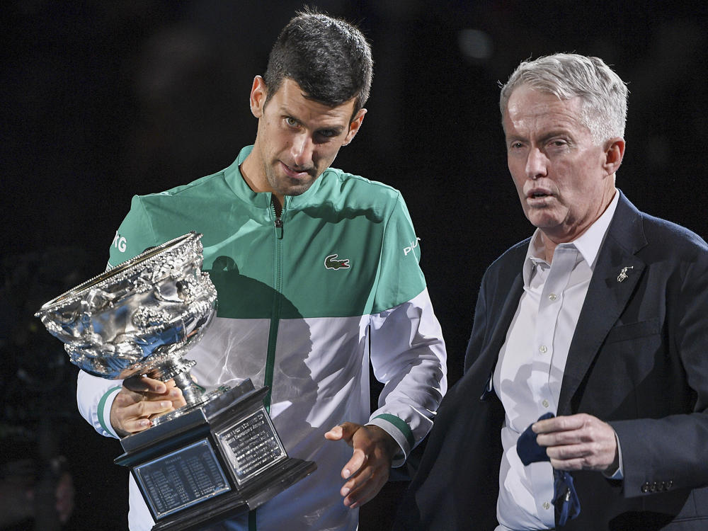 Novak Djokovic stands with Australian Open tournament director Craig Tiley during the trophy presentation at the Australian Open tennis championships in Melbourne, Australia, last February.