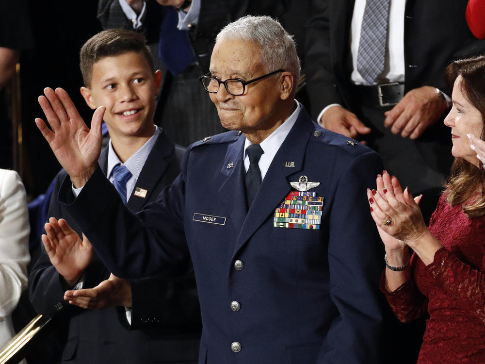 Tuskegee Airman Charles McGee and his great grandson Iain Lanphier are seen during President Donald Trump's State of the Union address on Feb. 4, 2020. McGee, one of the last surviving Tuskegee Airmen, who flew 409 fighter combat missions over three wars, died Sunday.