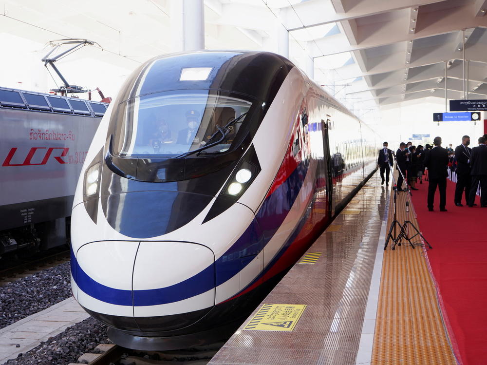 A train is ready on the station during the handover ceremony of the high-speed rail project in Vientiane, Laos, connecting the city with Kunming, China, on Dec. 3, 2021.