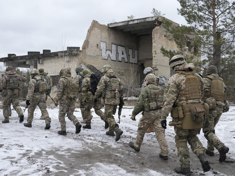 Members of Ukraine's Territorial Defense Forces, volunteer military units, train close to Kyiv on Saturday. Dozens of civilians have been joining Ukraine's army reserves in recent weeks amid fears about Russian invasion.