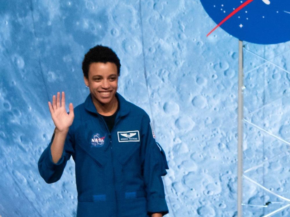 NASA astronaut Jessica Watkins waves at the audience during the astronaut graduation ceremony at Johnson Space Center in Houston Texas, on January 10, 2020.