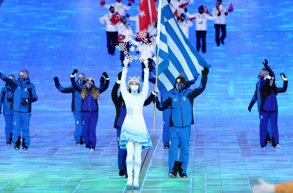 Flag bearers Apostolos Angelis and Maria Ntanou of Team Greece carry the flag of Greece during the opening ceremony of the 2022 Winter Olympics in Beijing.