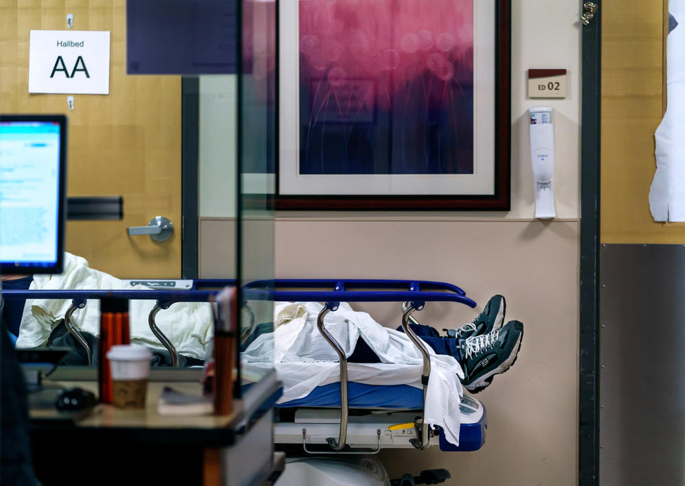 A patient waits for care in the hallway of the emergency department at Salem Health in Salem, Oregon on Jan. 27.