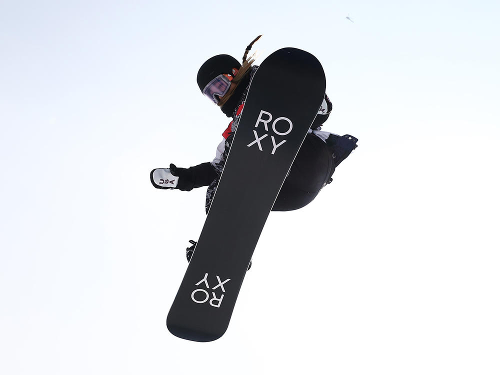 Chloe Kim performs a trick during the women's snowboard halfpipe final at the Beijing Olympics.