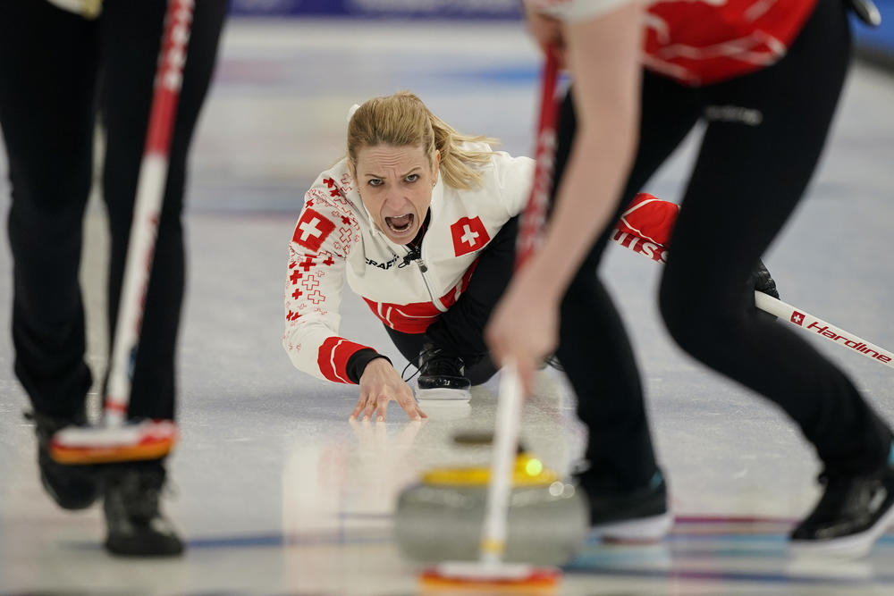 Switzerland's Silvana Tirinzoni yells to her sweepers during a women's curling match against Britain at the Beijing Winter Olympics Thursday, Feb. 10, 2022, in Beijing.