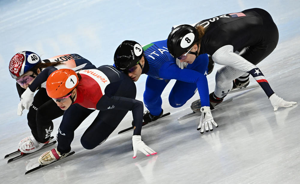 South Korea's Choi Min-jeong, Netherlands' Suzanne Schulting, Italy's Arianna Fontana and USA's Kristen Santos compete in the final A of the women's 1000m short track speed skating event during the Beijing 2022 Winter Olympic Games at the Capital Indoor Stadium in Beijing on February 11, 2022.
