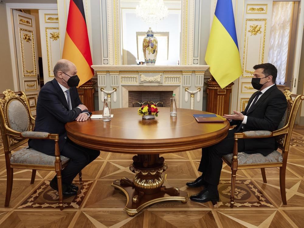Ukrainian President Volodymyr Zelenskyy, right, speaks to German Chancellor Olaf Scholz during their meeting at The Mariinskyi Palace in Kyiv, Ukraine, on Monday. Scholz visited Ukraine as part of a flurry of Western diplomacy aimed at heading off a feared Russian invasion that some warn could be just days away.