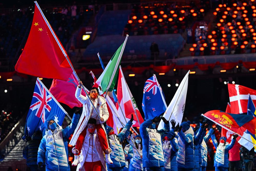 China's flag bearer Xu Mengtao, top left, parades during the closing ceremony of the Beijing 2022 Winter Olympic Games, at the National Stadium, known as the Bird's Nest, in Beijing, on February 20, 2022.