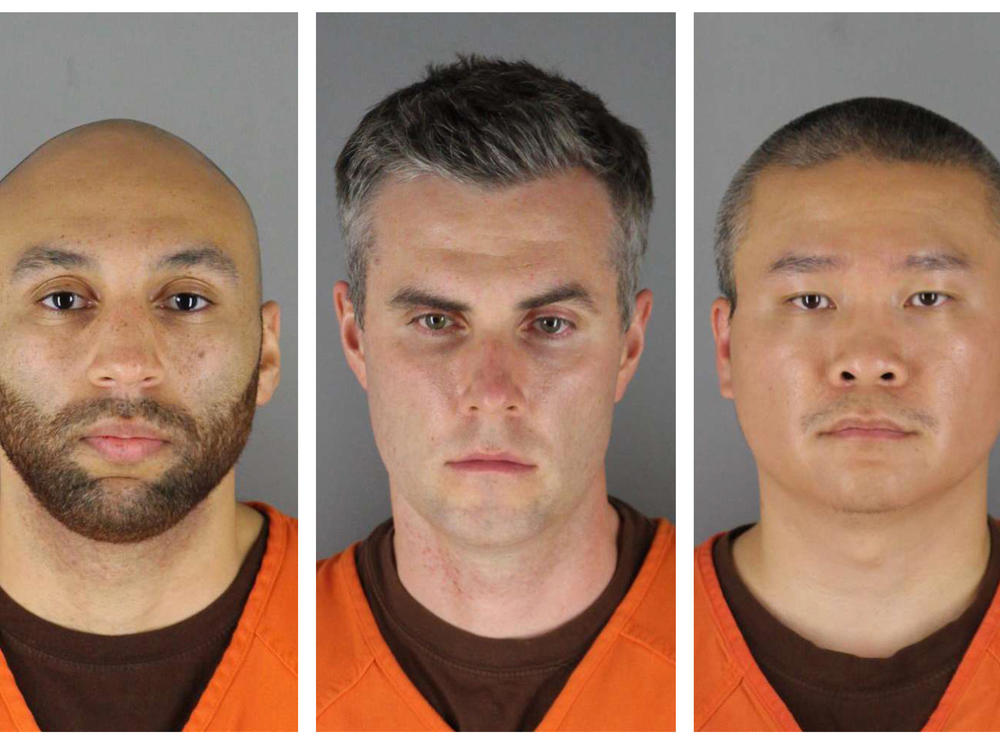 Former Minneapolis police officers, from left, J. Alexander Kueng, Thomas Lane and Tou Thao are on trial in federal court accused of violating George Floyd's civil rights as fellow officer Derek Chauvin killed him.