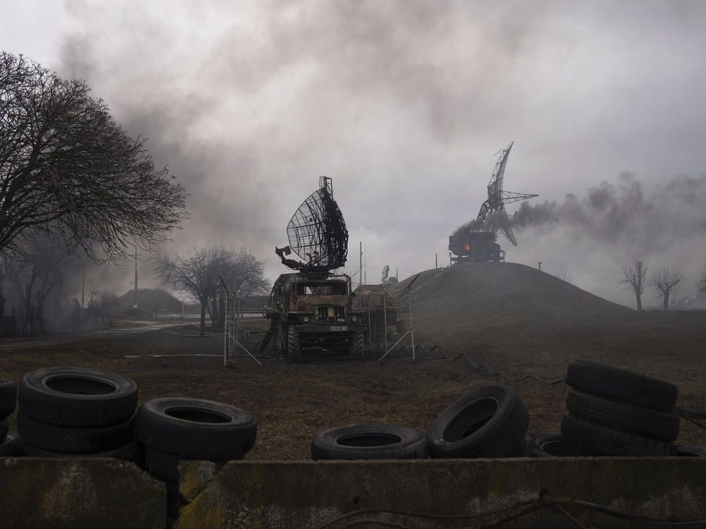 Smoke rises from an air defense base in the aftermath of an apparent Russian strike in Mariupol, Ukraine, on Thursday.