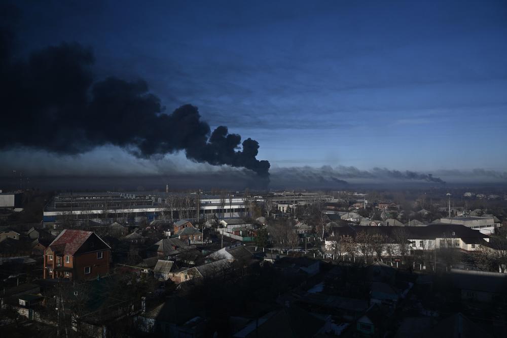 Black smoke rises from a military airport in Chuhuiv, near Kharkiv, Ukraine, on Thursday, Feb. 24. Russian President Vladimir Putin announced a military operation in Ukraine on Thursday, with explosions heard soon after across the country.