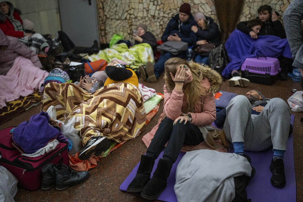 People rest in the Kyiv subway, using it as a bomb shelter in Kyiv, Ukraine, Thursday, Feb. 24, 2022.