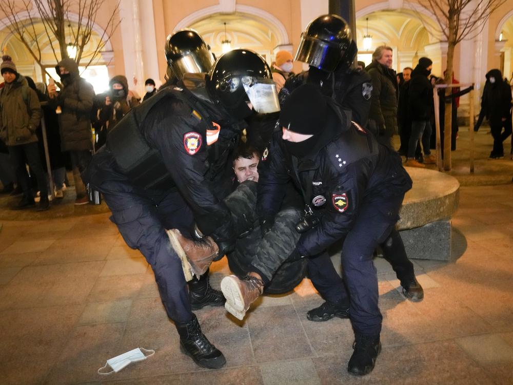 Police detain a demonstrator during a protest in St. Petersburg, Russia, on Saturday against Russia's attack on Ukraine. People took to the streets of Moscow and St. Petersburg for the third straight day despite mass arrests.