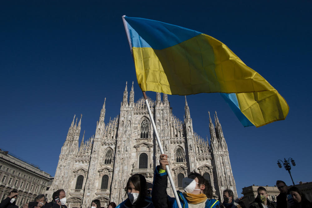 A person waves the Ukrainian flag during a demonstration against Russia's invasion of Ukraine in Milan, Italy, on Saturday.