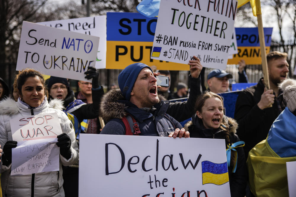 People participate in a pro-Ukrainian demonstration in front of the White House on Saturday in Washington, D.C.
