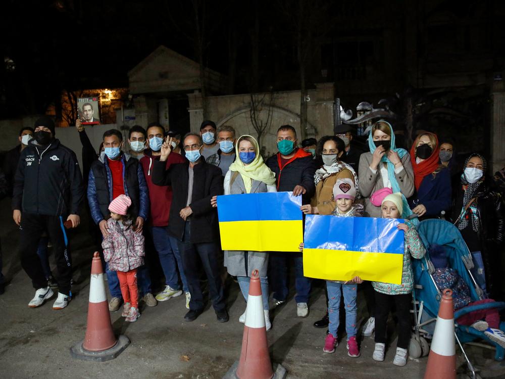 Iranians and Ukrainian nationals rally in front of the Ukraine embassy in Tehran on Saturday to show support for Kyiv and protest the Russian invasion.