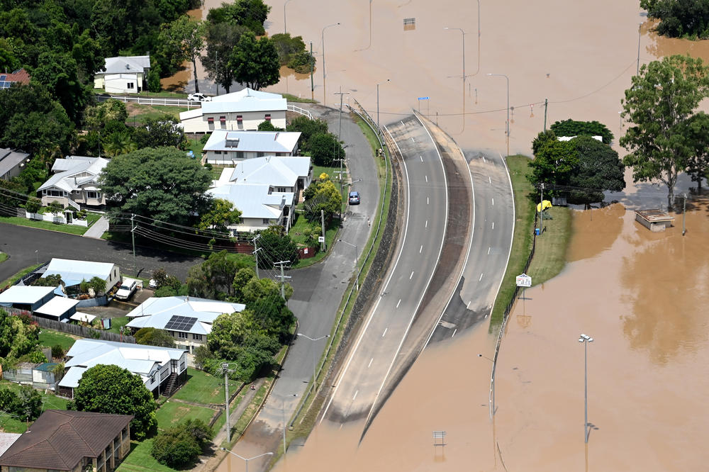 In an aerial view Sunday, floodwaters surround the town of Gympie, Australia, in an area north of Sunshine Coast.