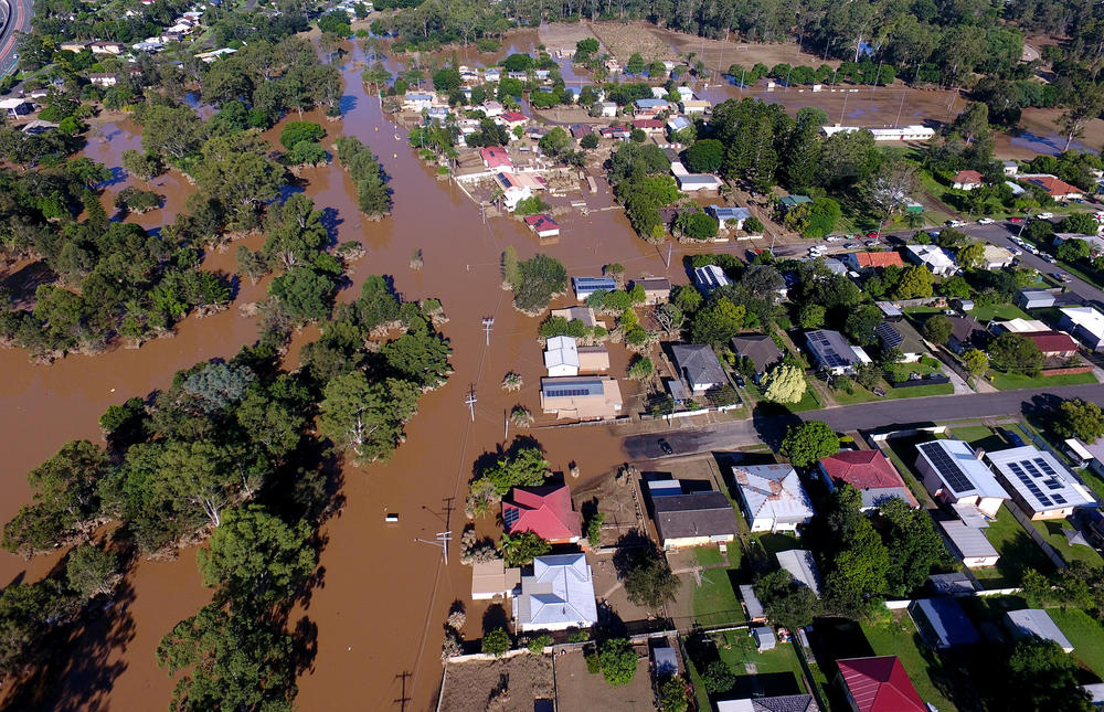 Properties in the suburb of Goodna, Australia, in the far south-western outskirts of Brisbane, are seen inundated by flood waters Tuesday.