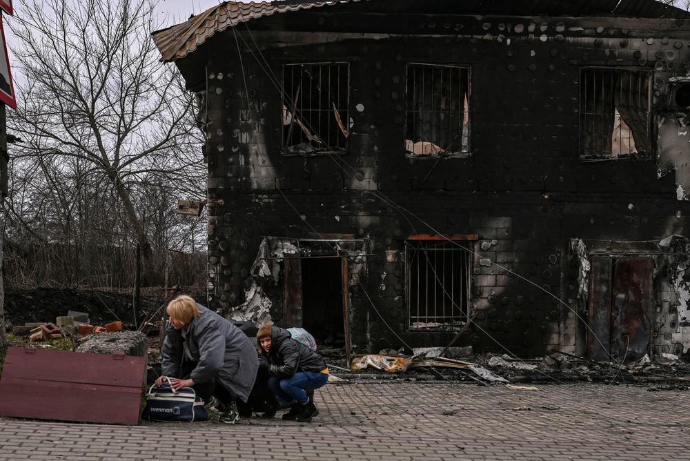 <strong>March 4:</strong> People take cover from shelling in the city of Bucha, west of Kyiv.