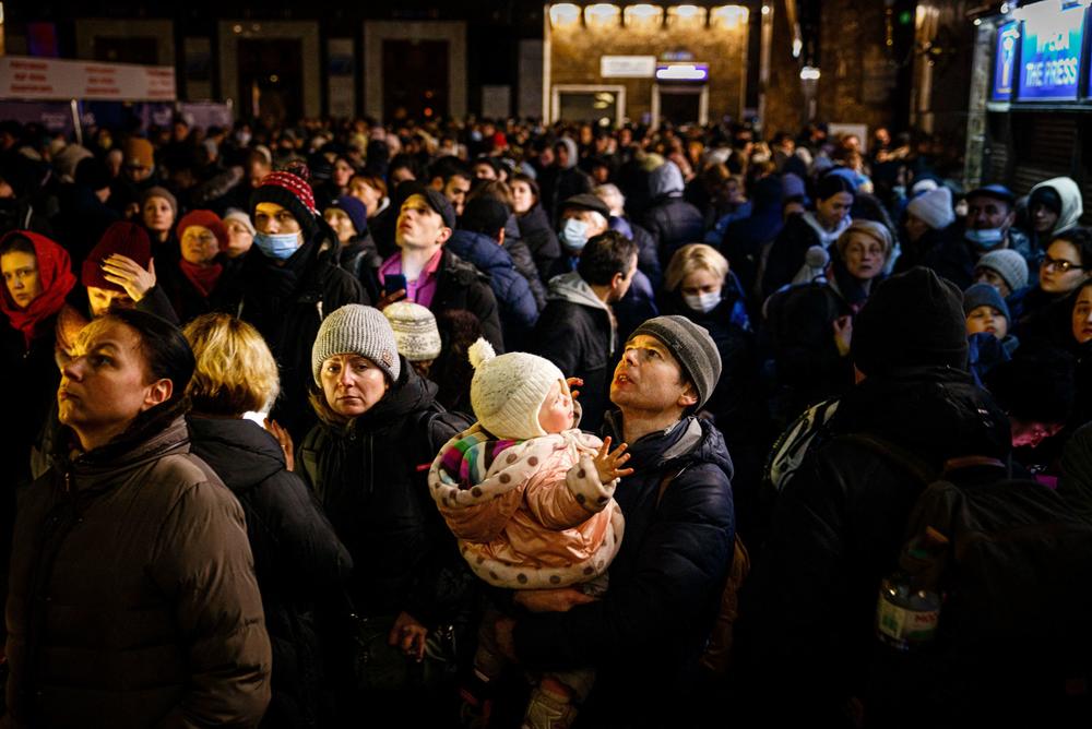 <strong>March 5:</strong> People wait to board an evacuation train at Kyiv central train station.