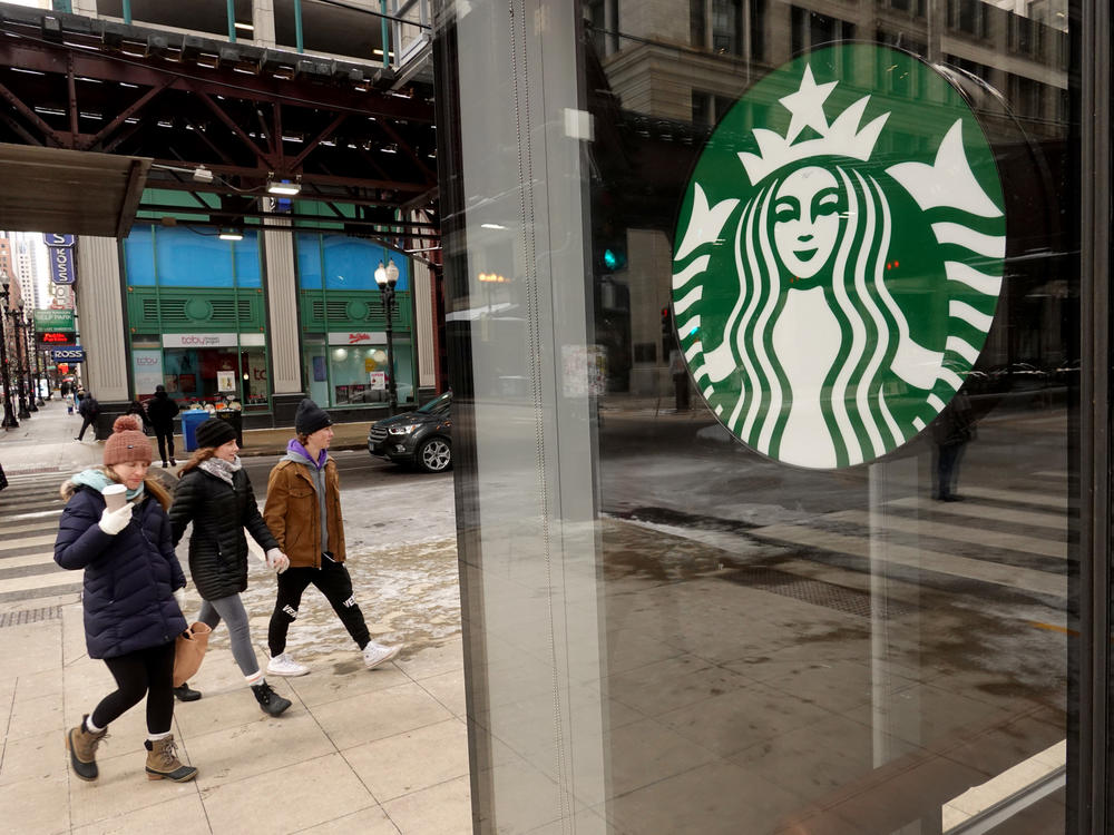 A Starbucks logo is seen on the window of one of the chain's coffee shops in Chicago, Illinois. Worker at the coffee shop have petitioned for a union vote, making it the first Starbucks in the Midwest to do so.